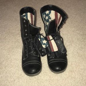 Black combat boots with American flag detail